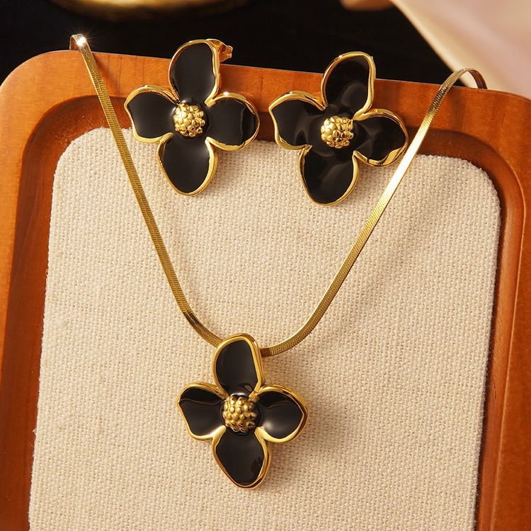 Immagine di 18k gold plated  Black And Gold Flower Necklace And Earrings Set 1
