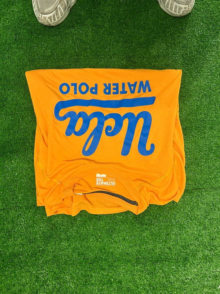 Orange T-Shirt With Blue Text