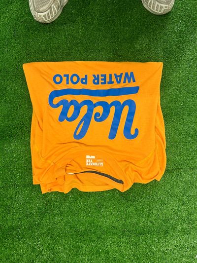 Orange T-Shirt With Blue Text