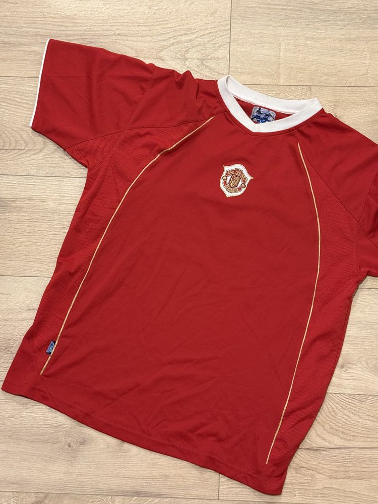 red football shirt with white collar and gold piping
