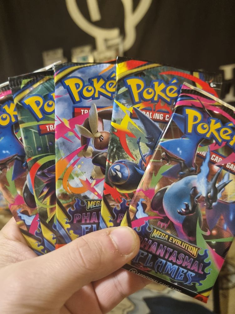 5x pokemon booster Packs shown on screen