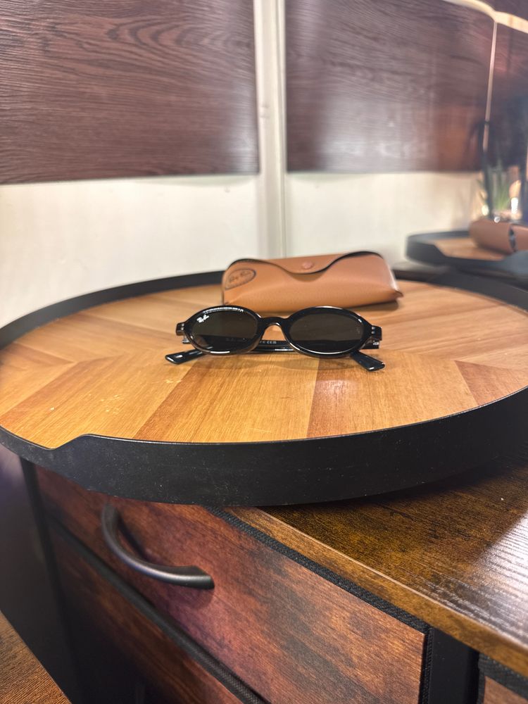 Black Oval Sunglasses With Brown Case