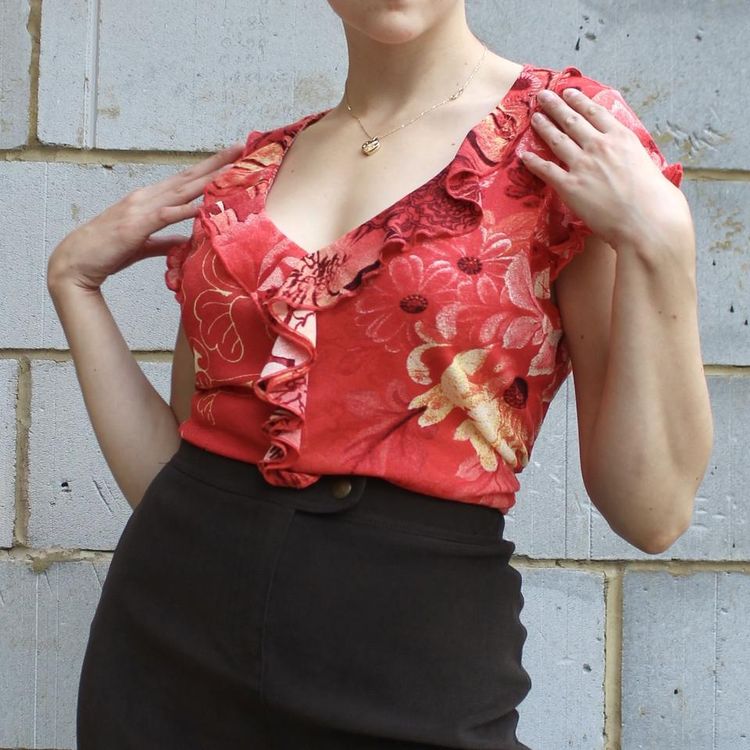 Other Semi sheer stretch floral graphic printed top with ruffle down the centre and zebra print on the bac product image