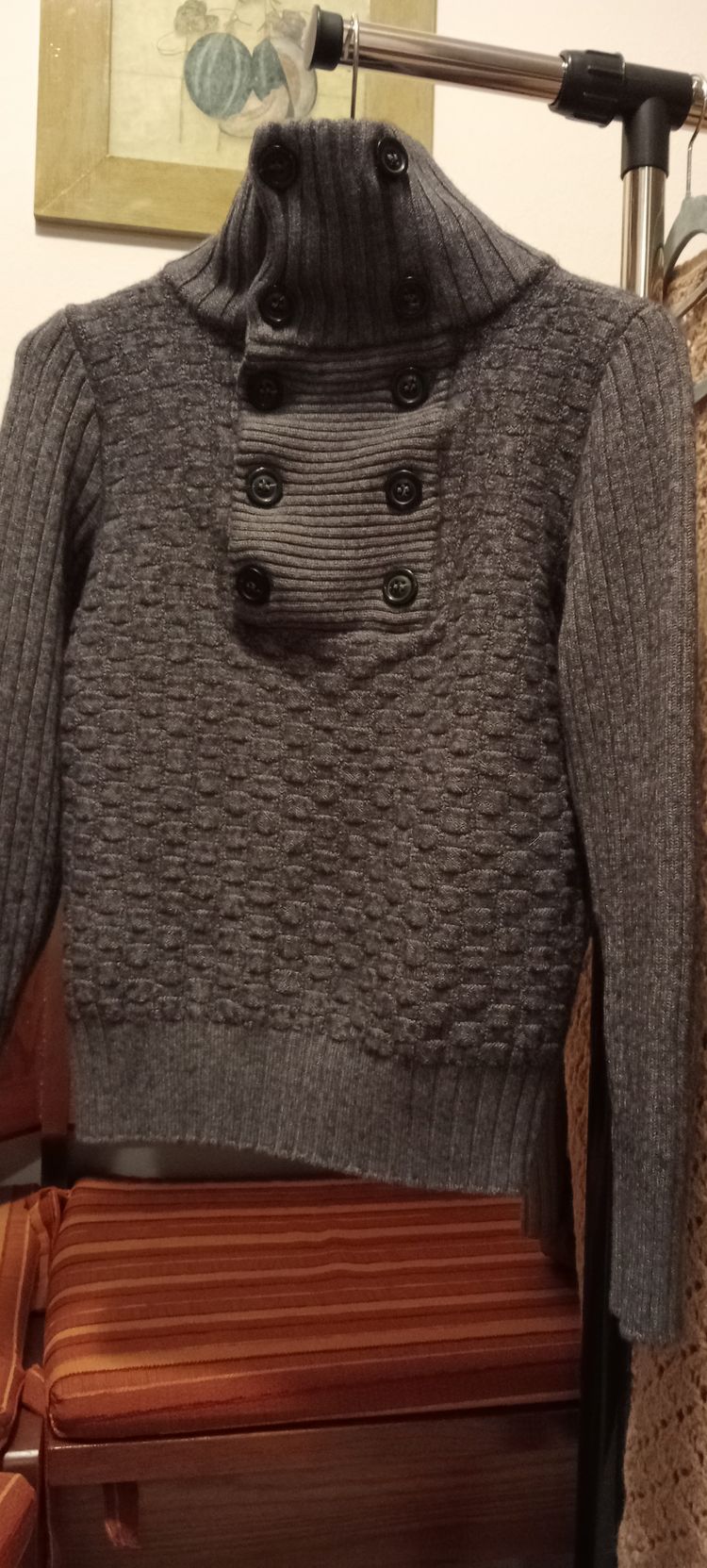 grey knitted sweater with buttoned high collar