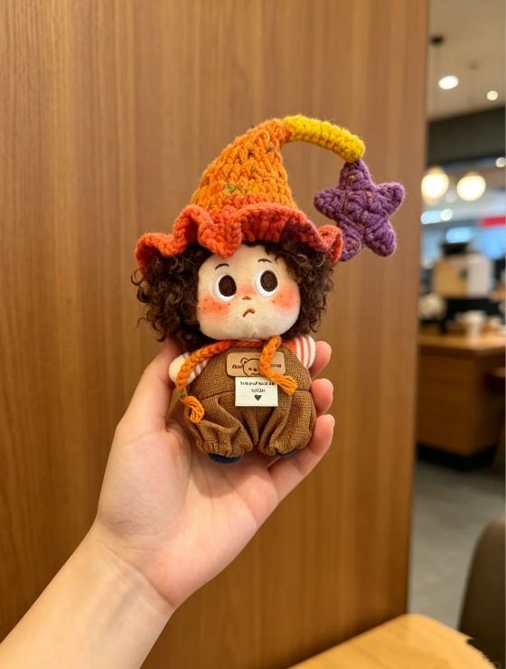 Immagine di Crocheted Doll With Colorful Hat 7