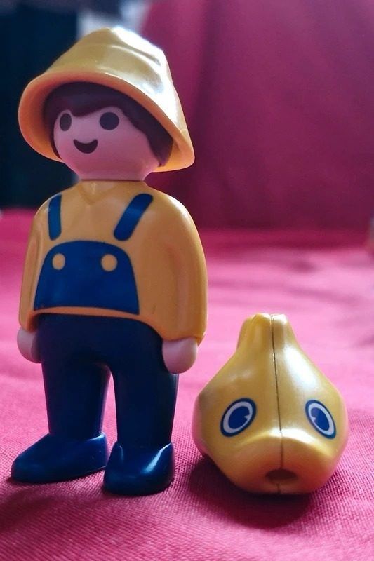 Yellow Raincoat Figure With Yellow Fish Toy image 1