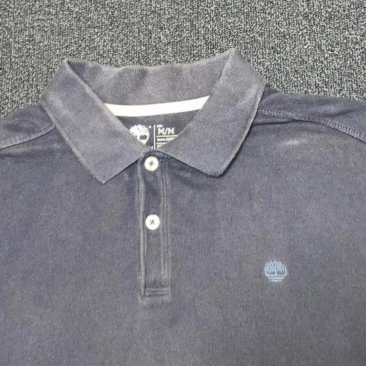 Vintage timberland navy blue washed out coloured polo shirt with small embroidered timberland logo 2