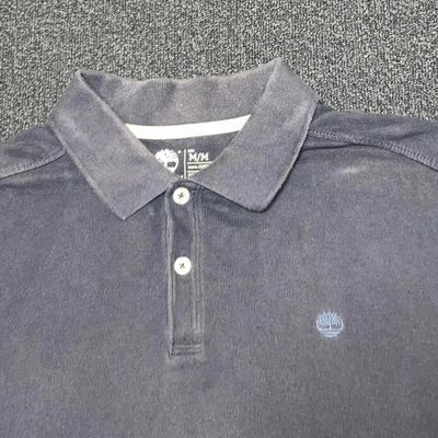 Vintage timberland navy blue washed out coloured polo shirt with small embroidered timberland logo 2