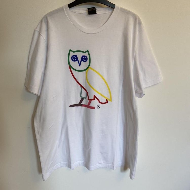Octobers Very Own Drake rapper OVO Octobers very own OVO owl t-shirt in white and multi coloured. Good Condition. Free product image