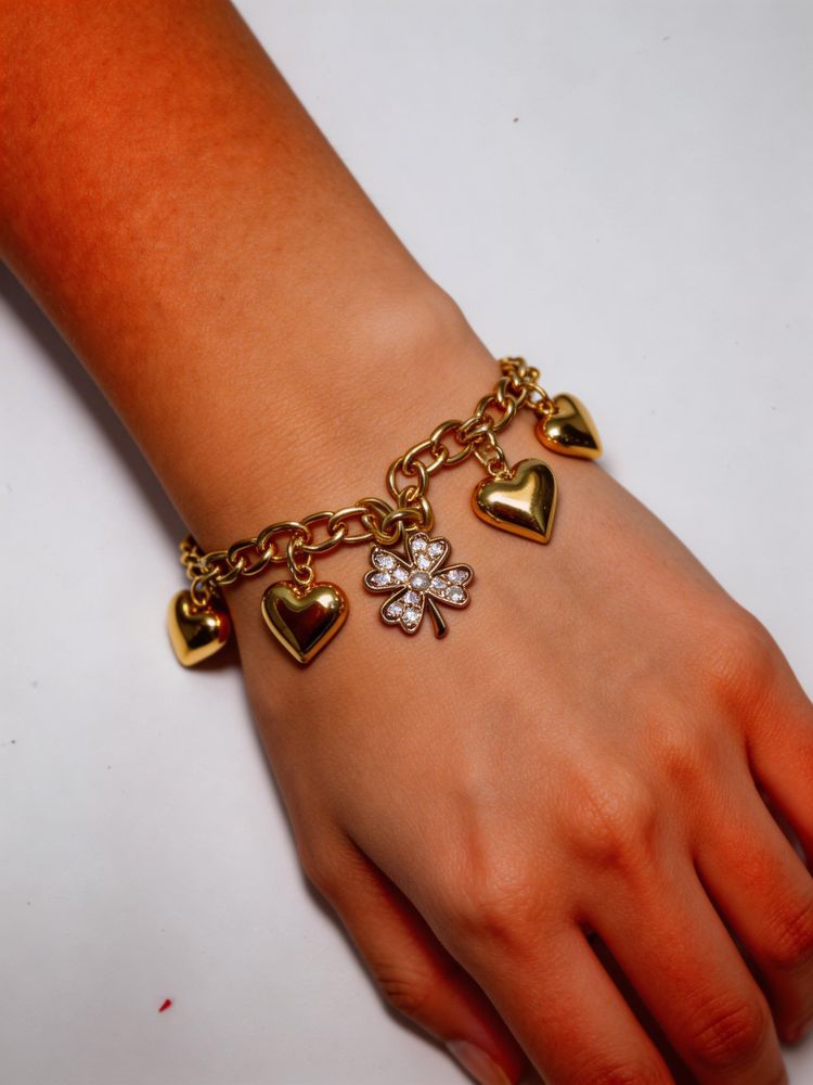 Gold Charm Bracelet With Hearts And Clover