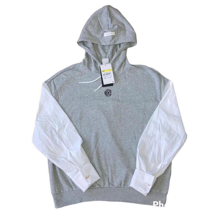BNWT Nike hoodie in light grey and white with central embroidered spellout Nike embroidered logo on