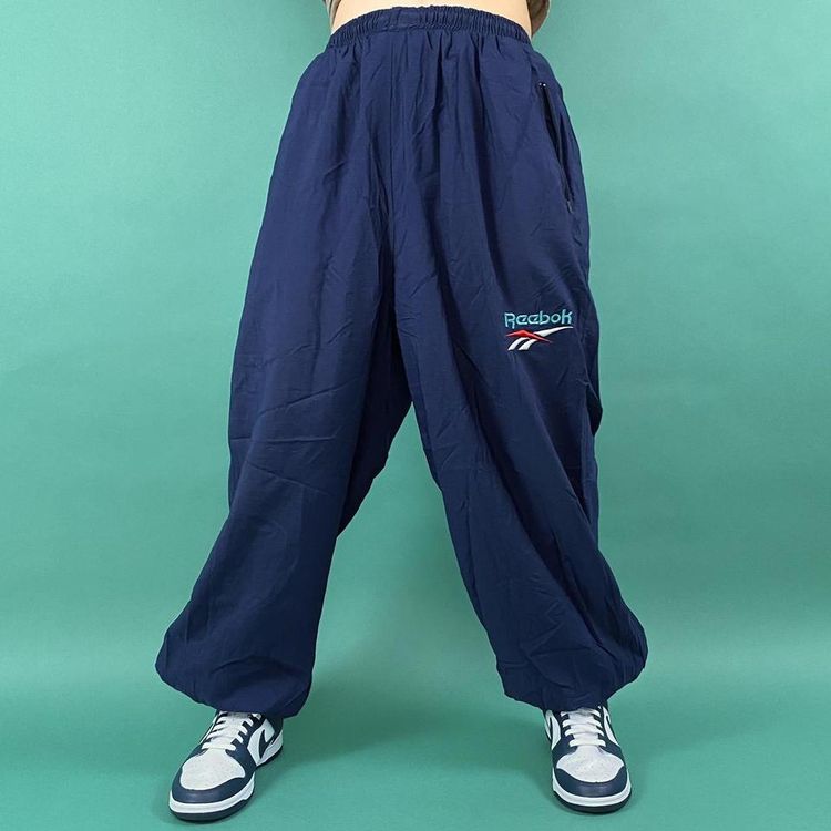 Reebok Vintage late 80s baggy navy shell reebok tracksuit bottoms. product image