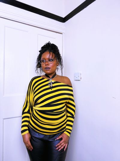 yellow and black striped long sleeve batwing top