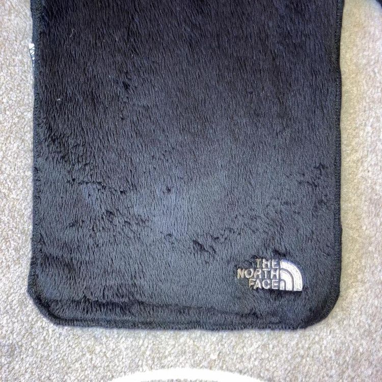 The north face black furry soft scarf with embroidered spellout logo on front 2