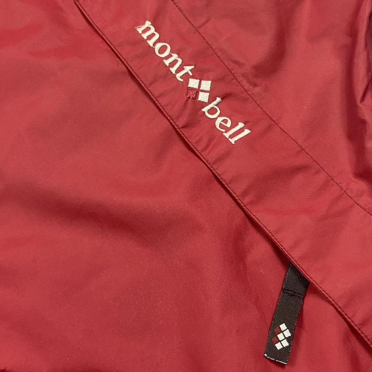 Mont Bell Jacket in red with white embroidered logo, two diagonal pockets on the chest. Peaked hood  image 3