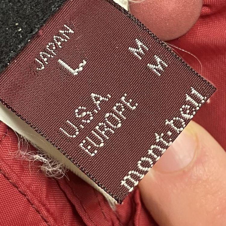 Mont Bell Jacket in red with white embroidered logo, two diagonal pockets on the chest. Peaked hood  image 4