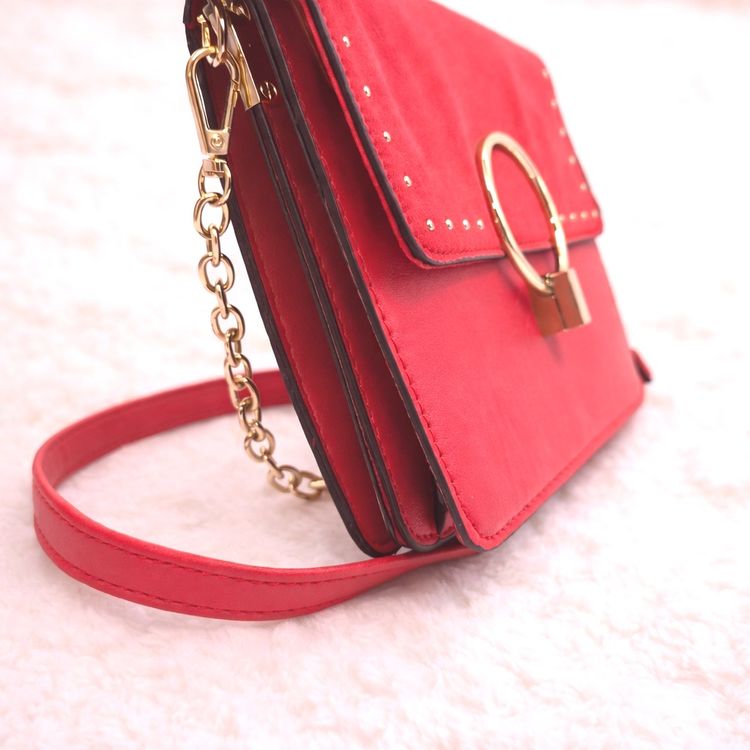 Red Handbag With Gold Ring And Chain Details