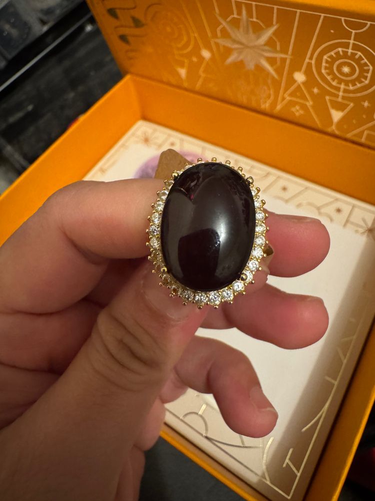 Gold Ring With Large Black Stone And Small Clear Stones