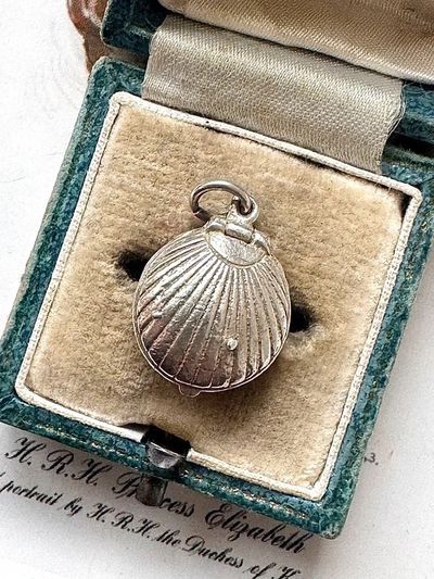 Silver Shell-Shaped Locket Pendant