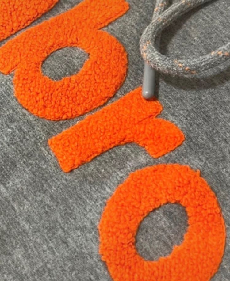 Umbro Grey Hoodie With Orange Textured Lettering imagen 2