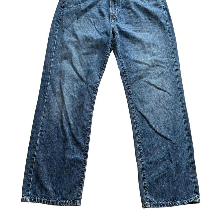 Tommy Hilfiger mid blue wash straight relaxed fit denim jeans. Small logo embroidery on the back poc 3