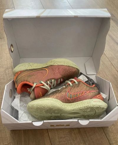 Nike LeBron XXI orange and green sneakers