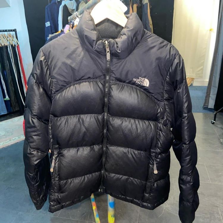 The North Face Black north face puffer. Fits true to size. Great condition other than small wear on zip as shown in product image
