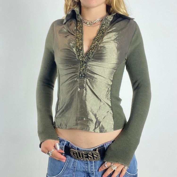 green long sleeve top with embellished neckline
