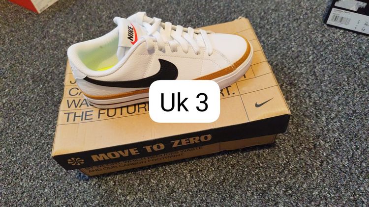 Nike White Sneakers With Black Swoosh