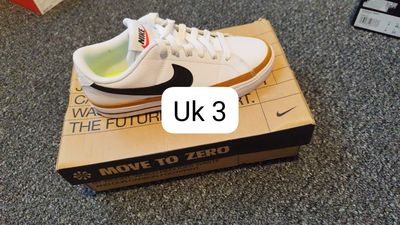 Nike White Sneakers With Black Swoosh