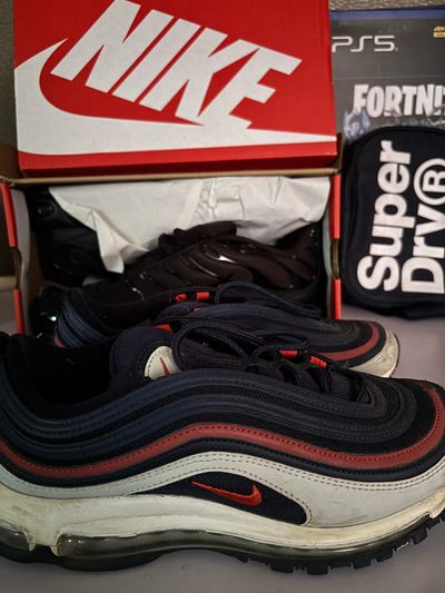 Nike Air Max 97 sneakers in the navy, white, and red