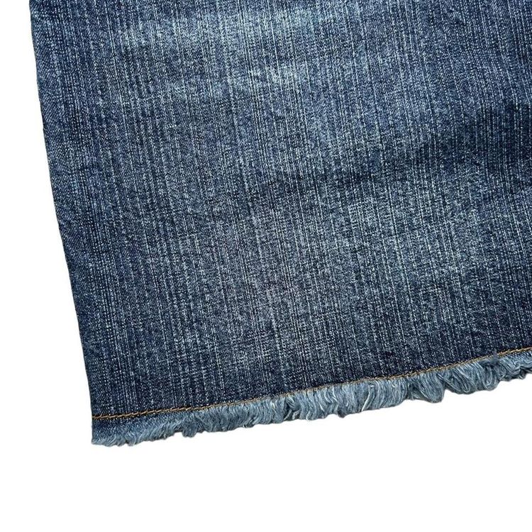 Y2K grain wash denim mini skirt with a raw hem image 4