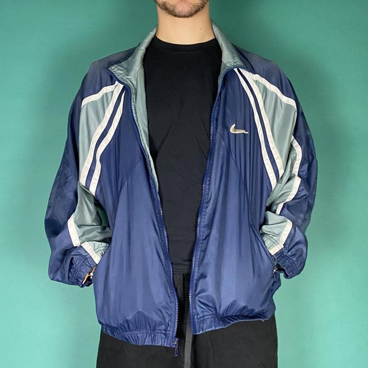 Vintage 90s Nike swoosh track jacket blue.