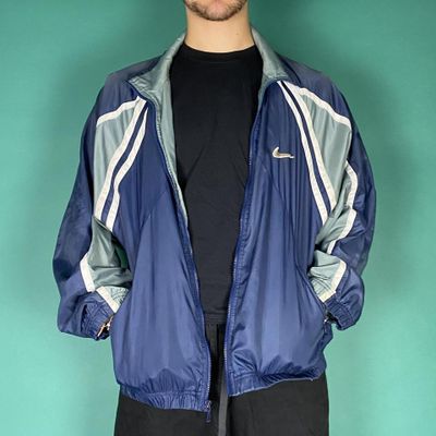 Vintage 90s Nike swoosh track jacket blue.