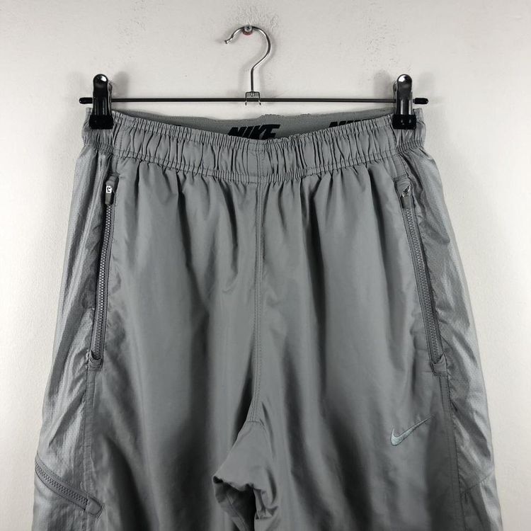 Grey vintage Nike shell tracksuit bottoms image 1