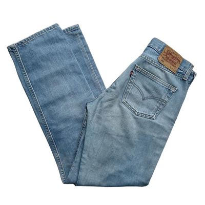 Light wash straight leg button fly Levi 501 jeans made from a stiff denim