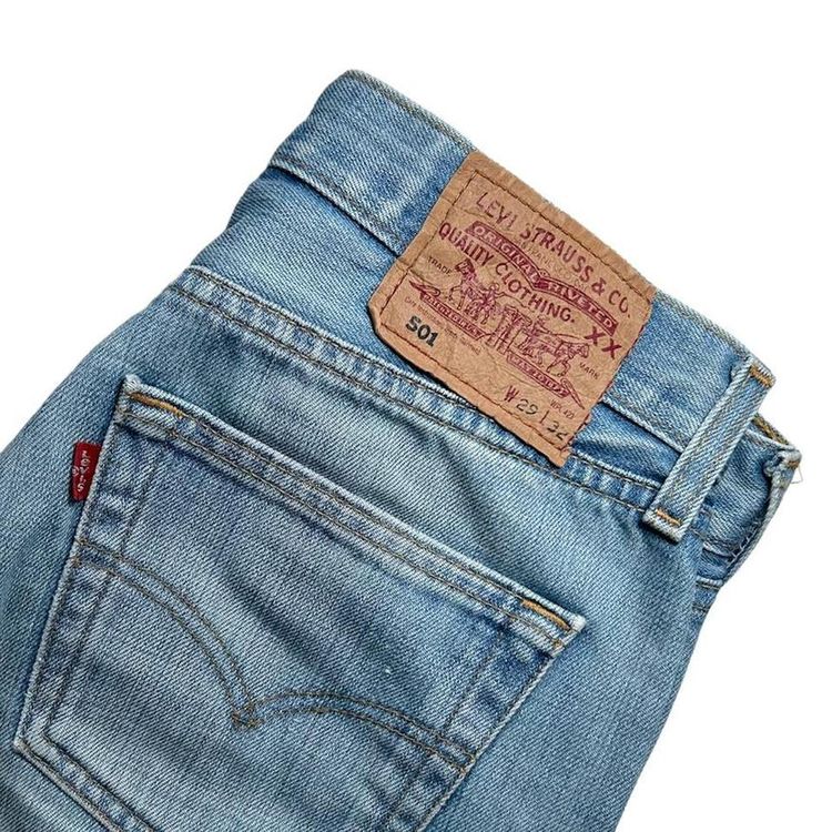 Light wash straight leg button fly Levi 501 jeans made from a stiff denim image 5