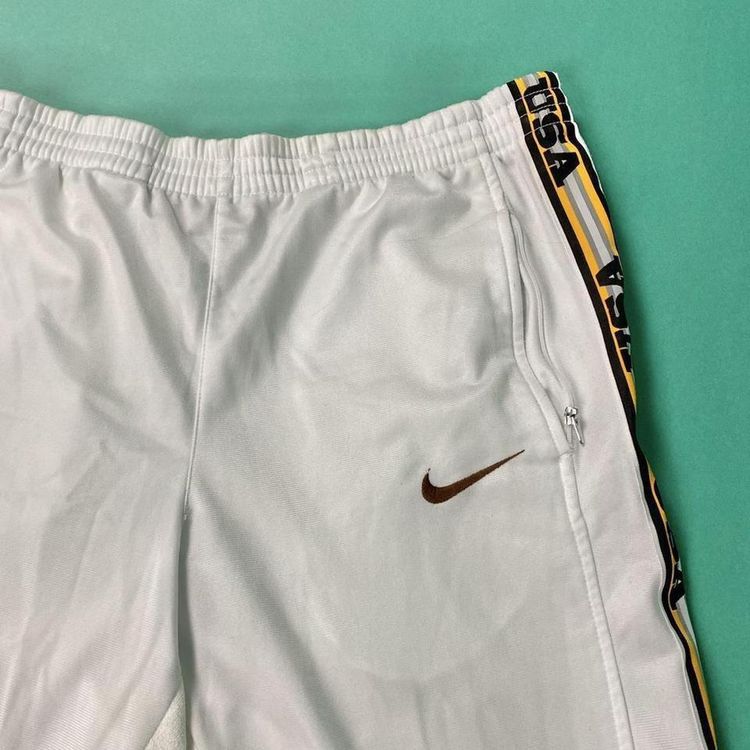 Vintage rare early 90s white Nike popper joggers / tracksuit bottoms.