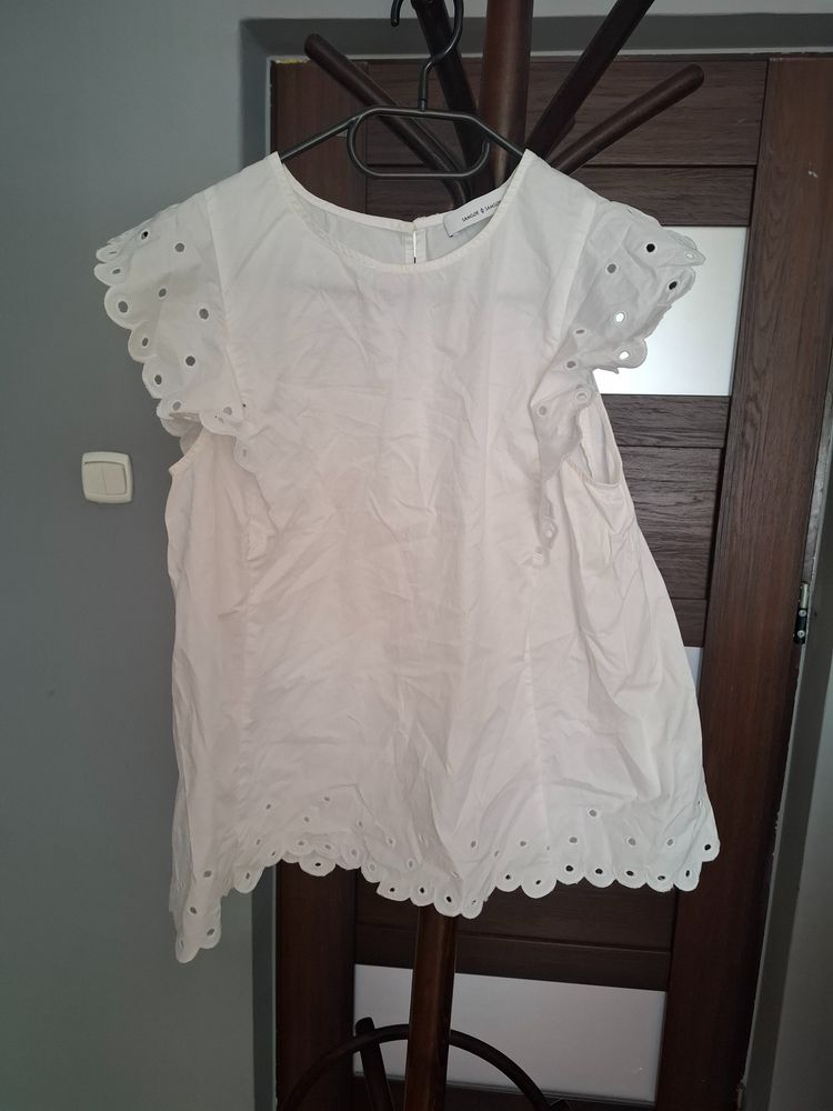 White Sleeveless Blouse With Eyelet Details