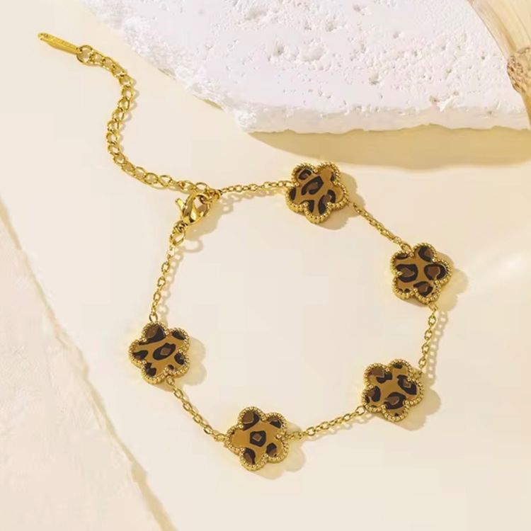 Gold-Tone Bracelet With Leopard Print Flower Charms image 1