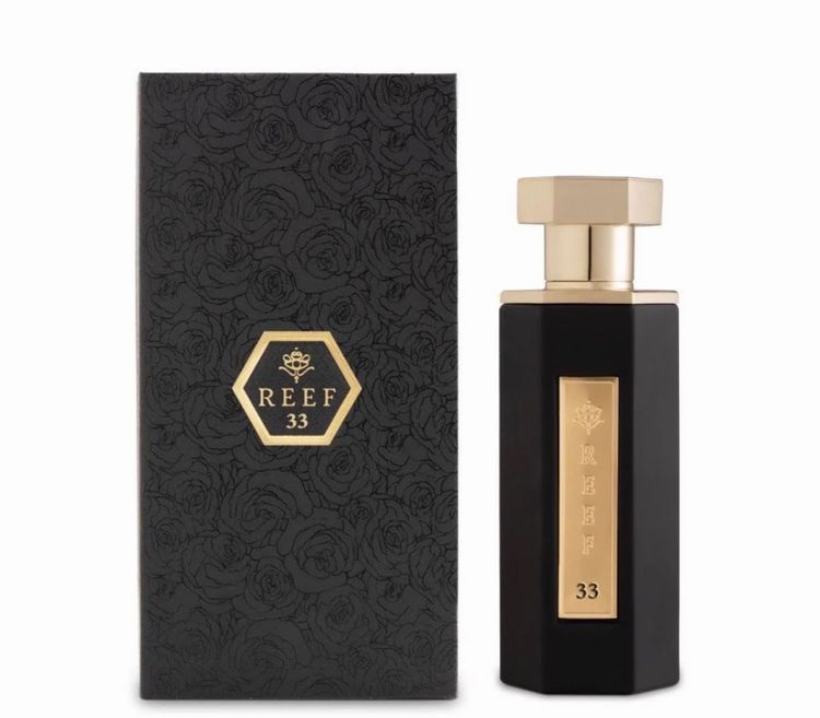 Black Perfume Bottle With Gold Accents And Box