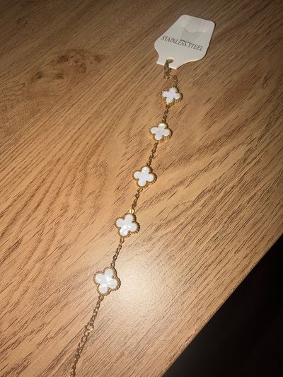 Gold-Tone Bracelet With White Clover Charms