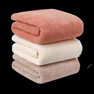 Stack Of Three Textured Blankets
