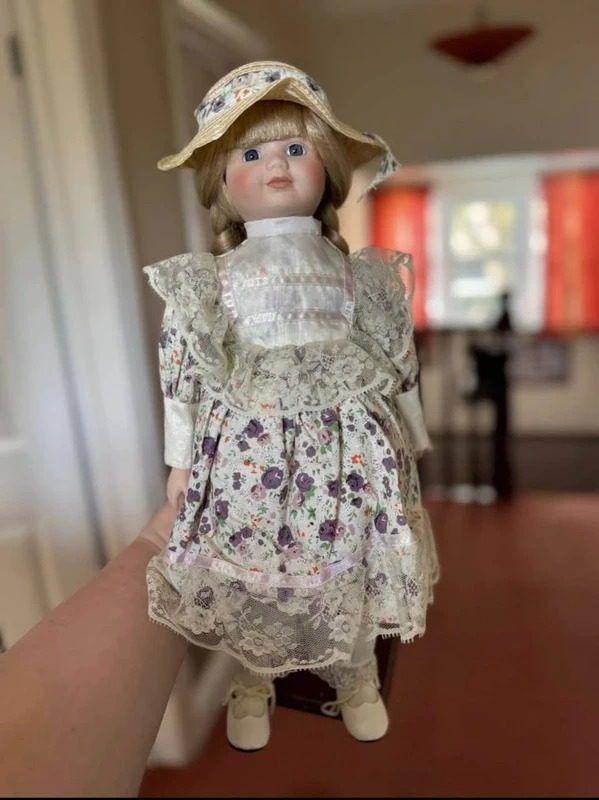 Porcelain Doll With Floral Dress And Lace Apron image 1