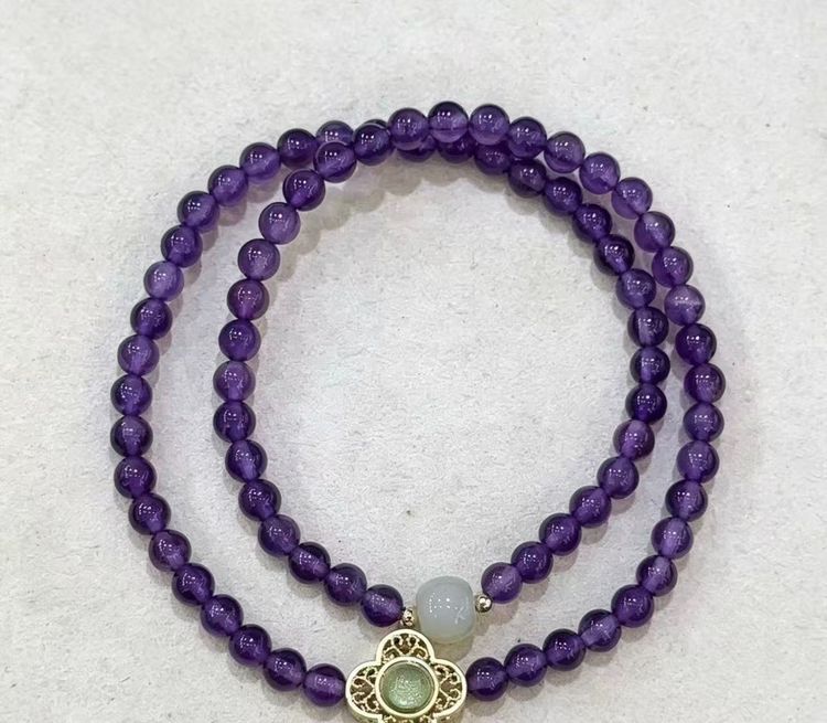 Purple Beaded Bracelet With Decorative Charm image 1