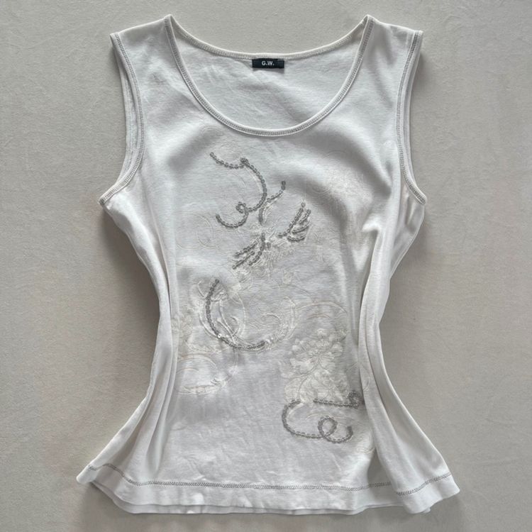 White Sleeveless Top With Embroidered Design