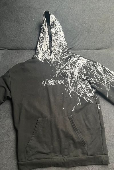 Black Hoodie With White Splatter Design And 'Chaos' Text