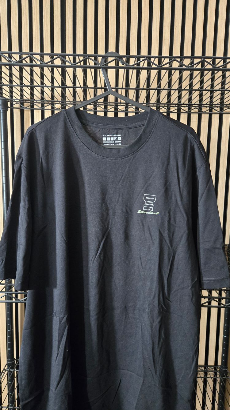 B129 DJK International Script Logo Black Tee Brand New
