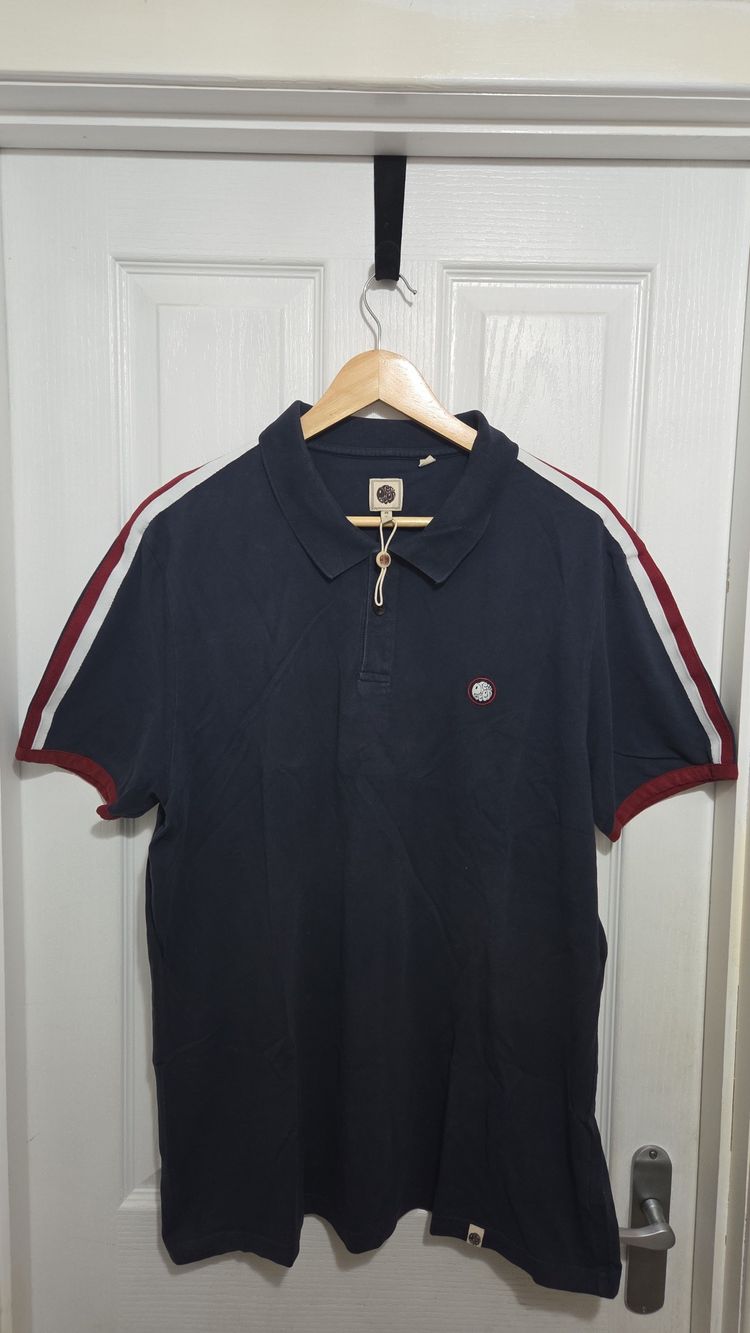 Immagine di Pretty Green Navy Polo Shirt With Red And White Sleeve Stripes 1