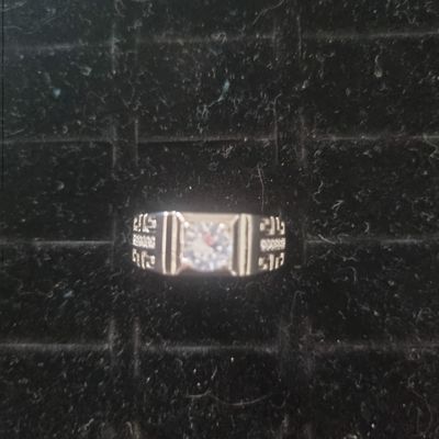 Silver Ring With Clear Stone And Engraved Pattern